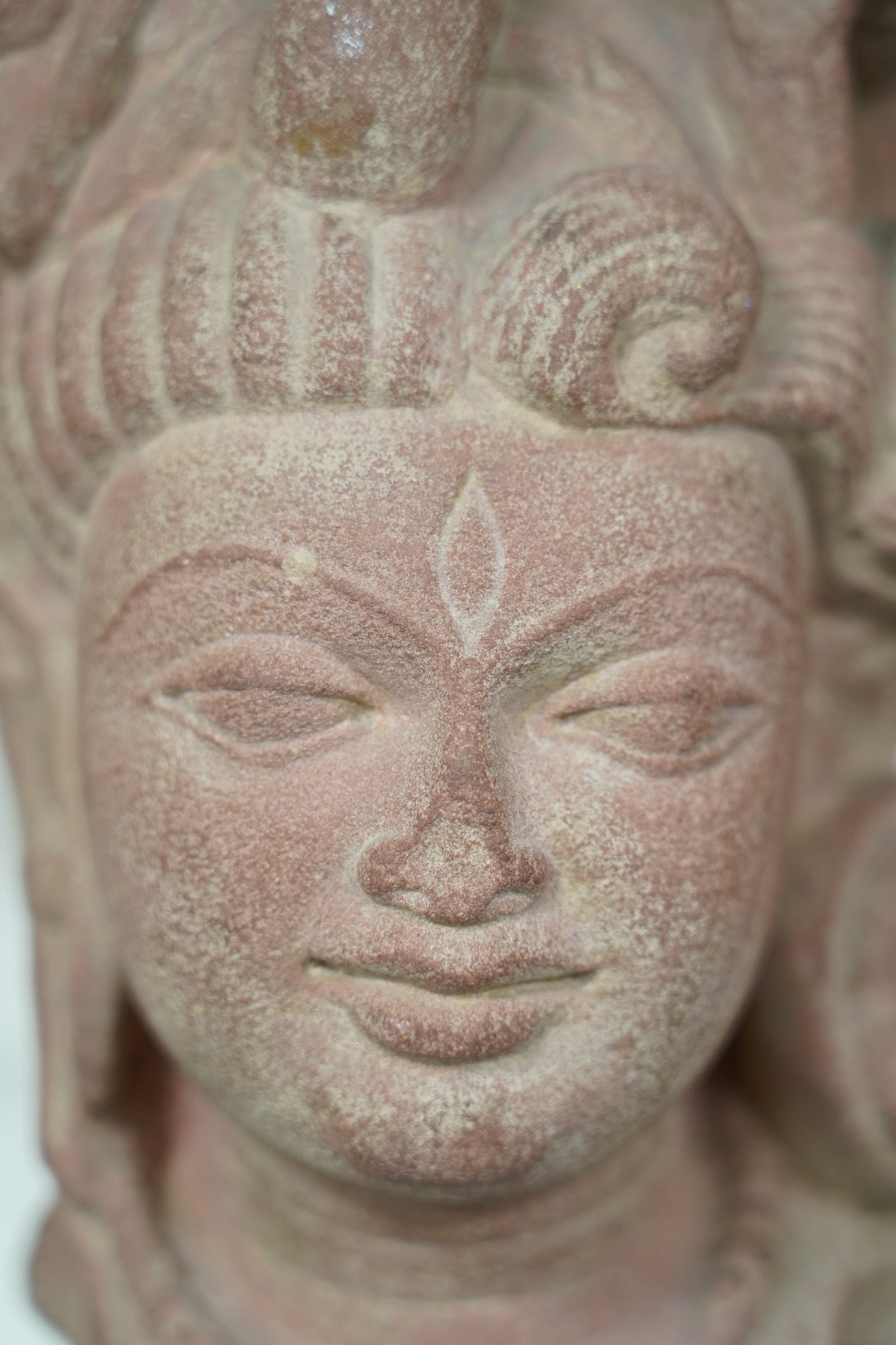 A red stone head of Ardhanarishvara, Muthura region, India, Gupta period, c.5th century A.D.